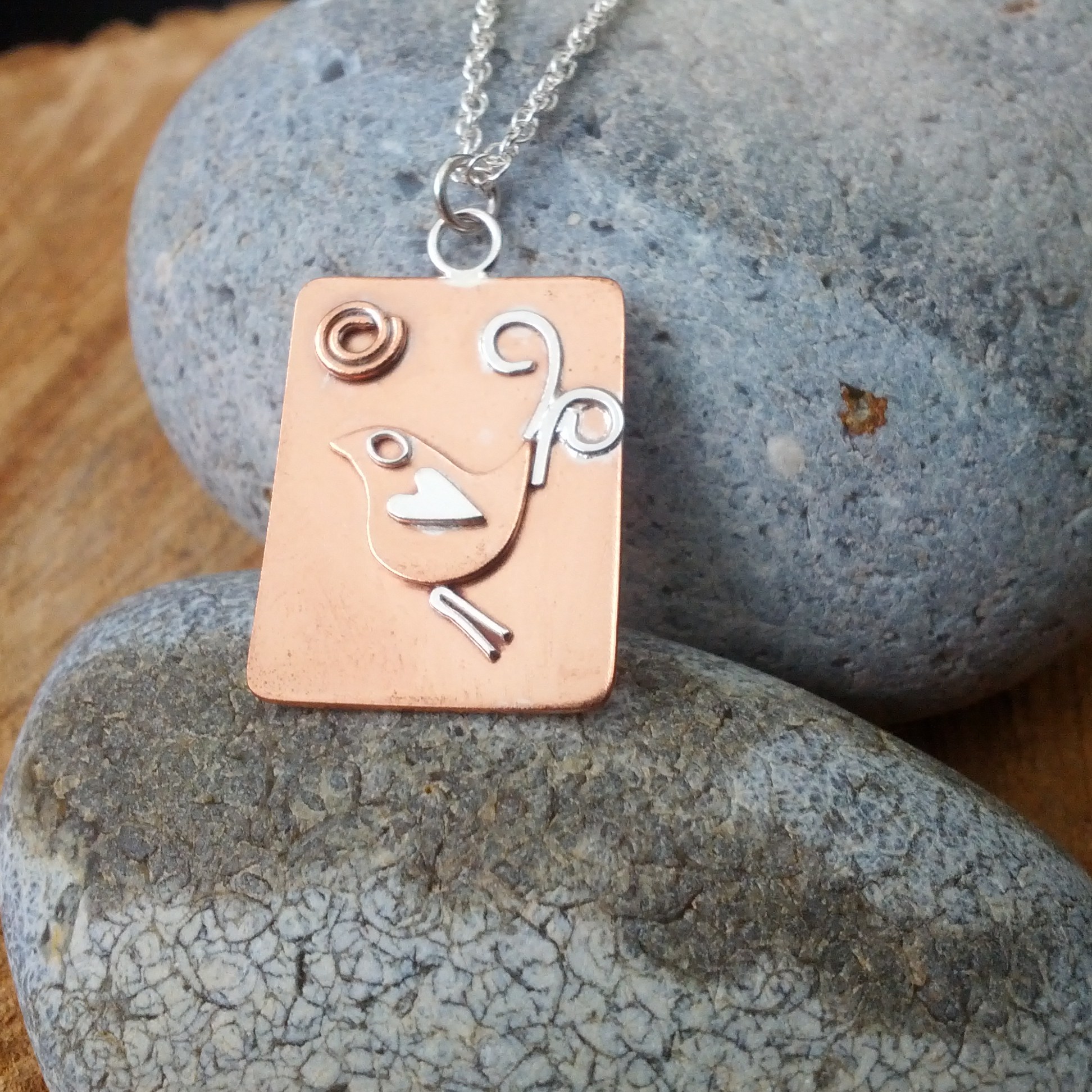 Copper bird and sun pendant