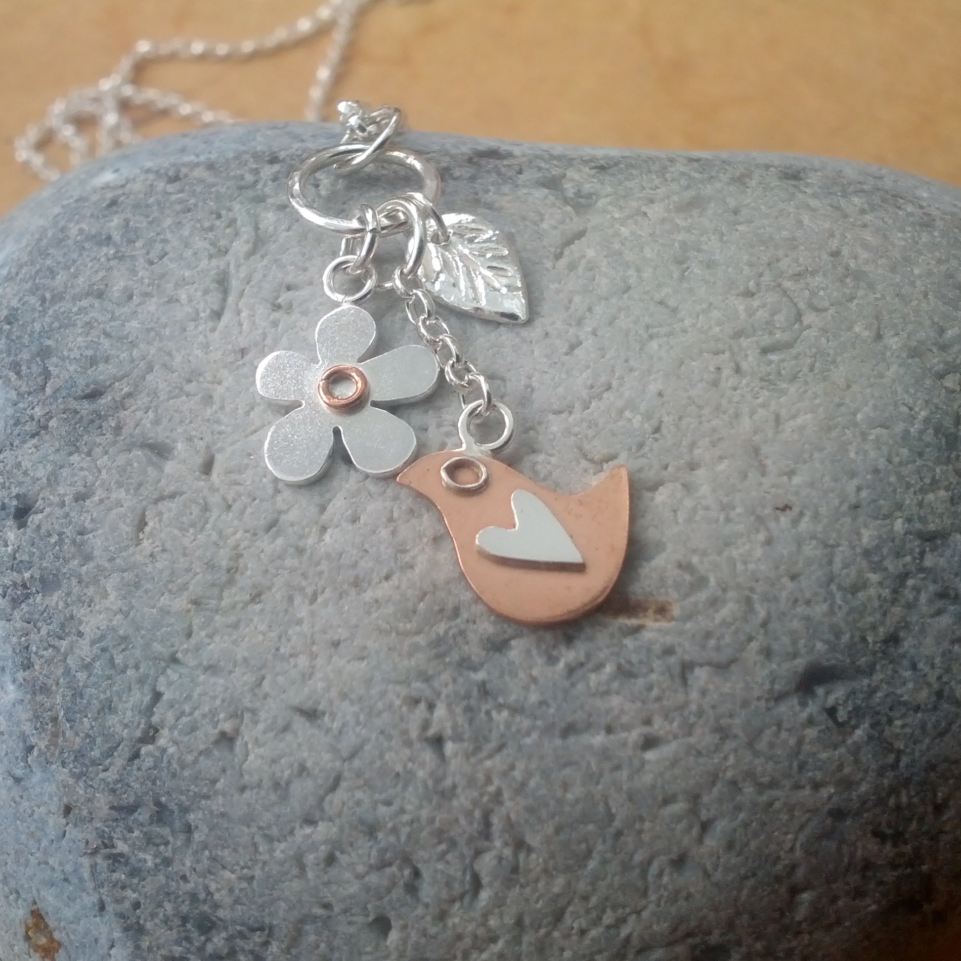 Bird, flower and leaf dangle necklace