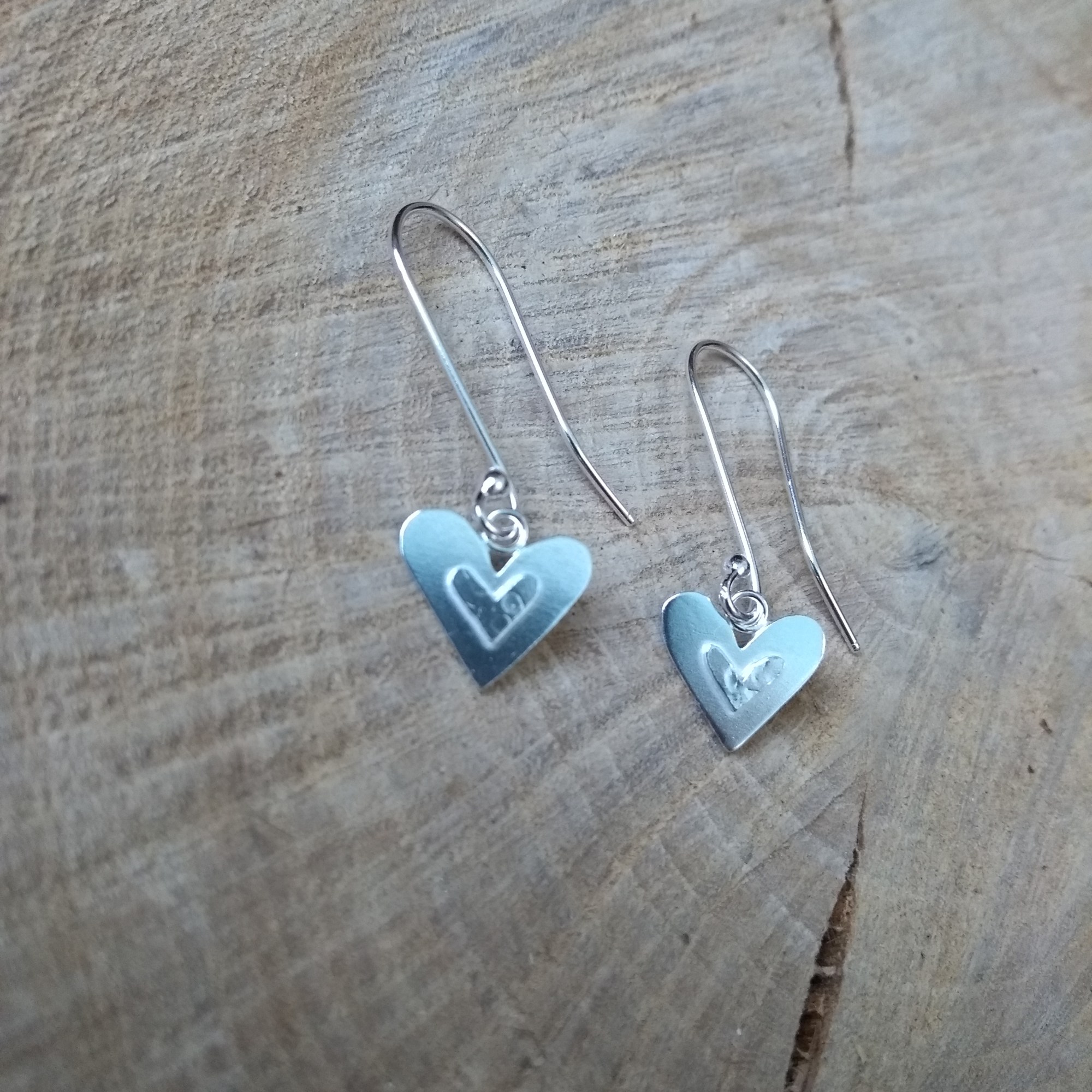 Silver heart dangle earrings