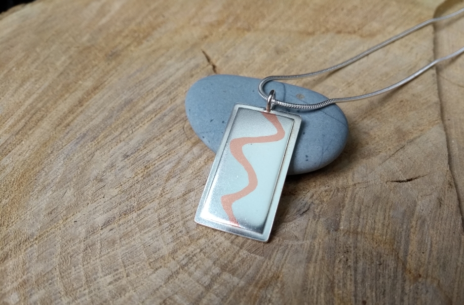 Silver and copper married metal pendant